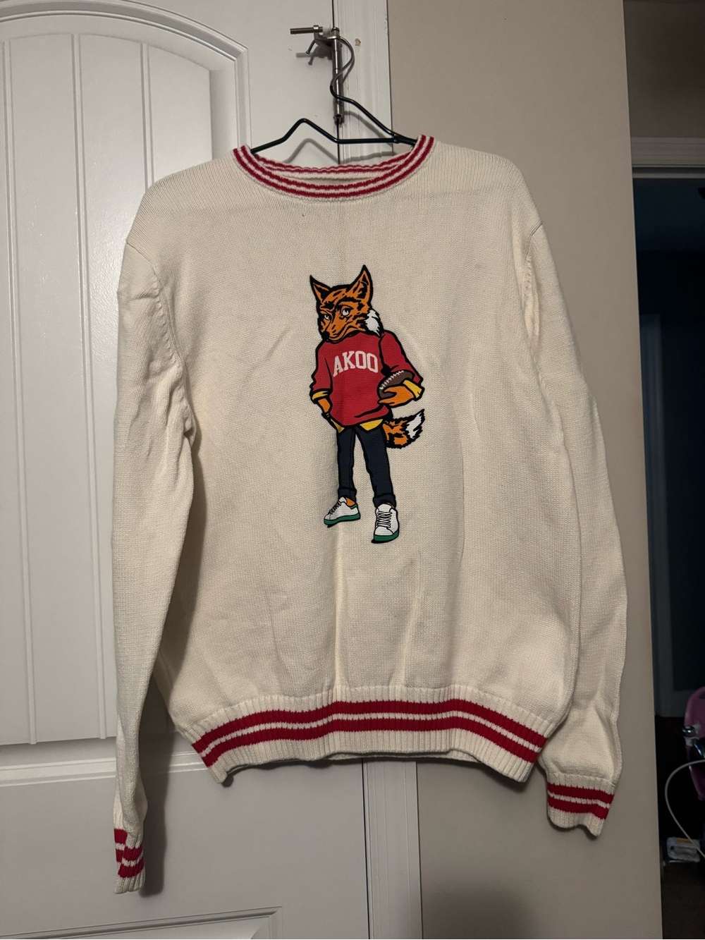 Akoo Cream Crewneck Sweater with Fox Graphic and Red Trim